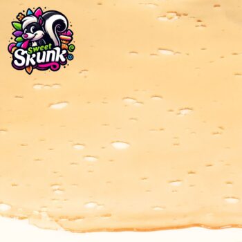 Close-up of Sweet Skunk Shatter by VanCity Labs – premium West Coast cannabis concentrate, ideal for those who want to buy cheap shatter online Canada and enjoy one of the best extracts online in Canada.