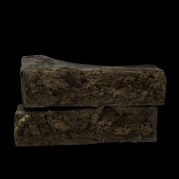 Close‑up of New York Diesel Hash by VanCity Labs – dark‑brown hash brick snapped in two, order hash online Canada, best hash online Canada, best extracts online Canada